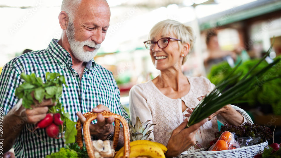 A man and woman with a shopping basket